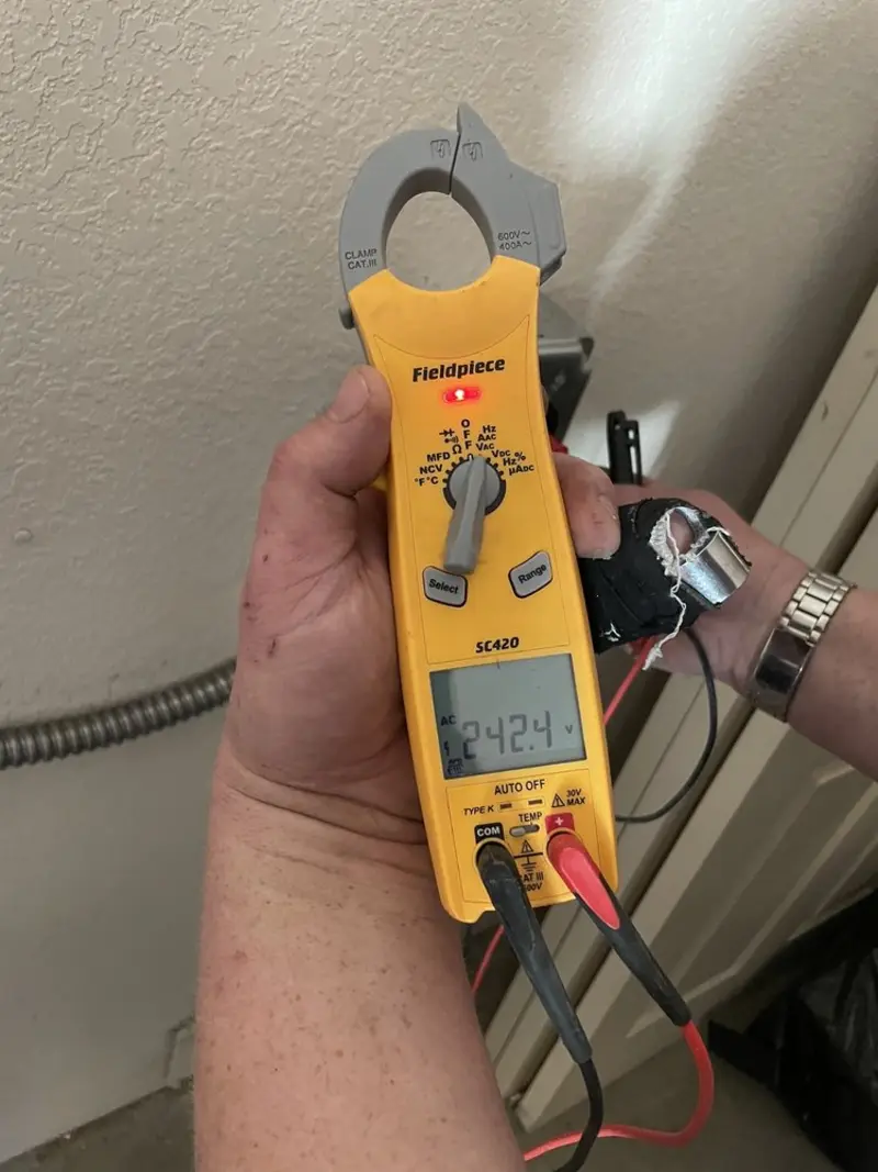 Voltage testing with clamp meter during Electrical Installation Services in Mount Vista